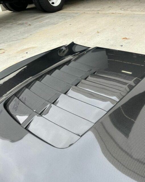 2015 – 2020 MUSTANG SHELBY GT350 TYPE-GT5 DOUBLE SIDED CARBON FIBER HOOD 2015-2022 Ford Mustang shelby Gt350 type GT5 double sided carbon fiber hood. Also fits GT350Rs, Includes gt500 style hood vent, improved heat extractions for gt350, brand new package. Type-GT5 double sided carbon fiber hood for 2015-2020 Ford Mustang Shelby GT350 and GT350R *Fits Shelby GT350 and GT350R only *Carbon fiber “skeleton” bonded to underside of carbon fiber hood – reduced weight *Vacuum infused process with 3K, 2×2 twill carbon fiber cloth, gloss finish *Included GT500 style hood vent, improved heat extraction for GT350 *Vent area measures approximately 24″x26″ *Included removable fiberglass rain tray *Hood mounts with OE hardware *All hoods require hood pins for safety reasons. *Heat shield required *Anderson Composites does not suggest re-installing gas shocks/dampers/struts *The use of a hood prop rod is highly recommended *Hoods are hand crafted and weigh approximately 26 lbs. (stock hood weighs 31 lbs.)