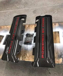 A set of 2011-2017 Mustang coyote hydro dipped coil covers in carbon fiber with red and black letter stripes.