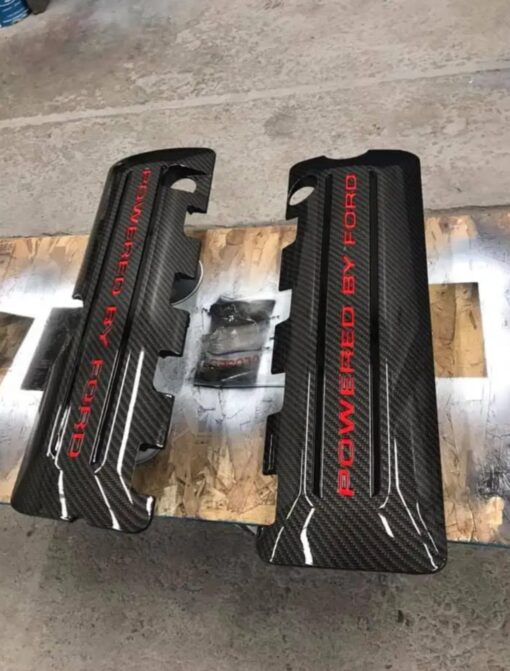 A set of 2011-2017 Mustang coyote hydro dipped coil covers in carbon fiber with red and black letter stripes.